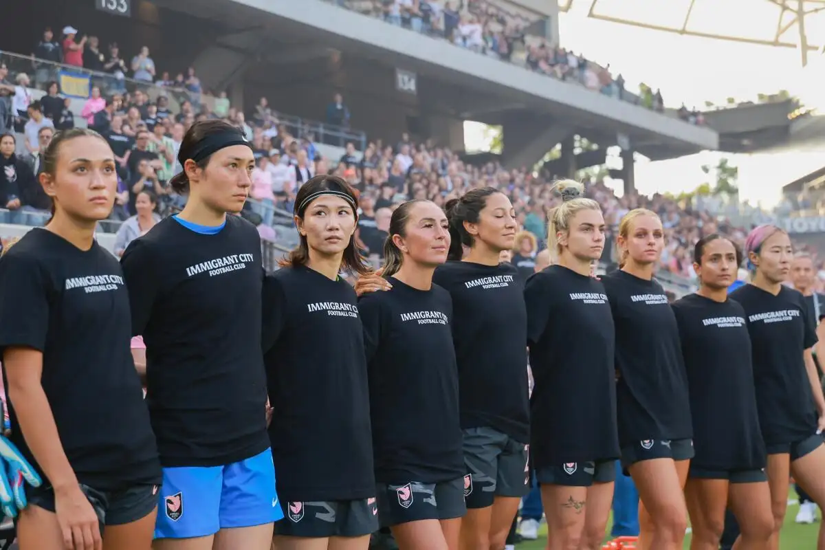 Angel City's players wear ‘Immigrant City Football Club’ shirts after Los Angeles raids