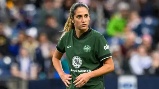 Portland's Savannah DeMelo remains hospitalized after collapsing during match