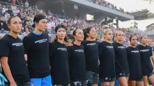 Angel City's players wear ‘Immigrant City Football Club’ shirts after Los Angeles raids